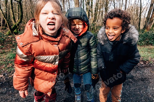 Preview: children in winter making faces at the camera