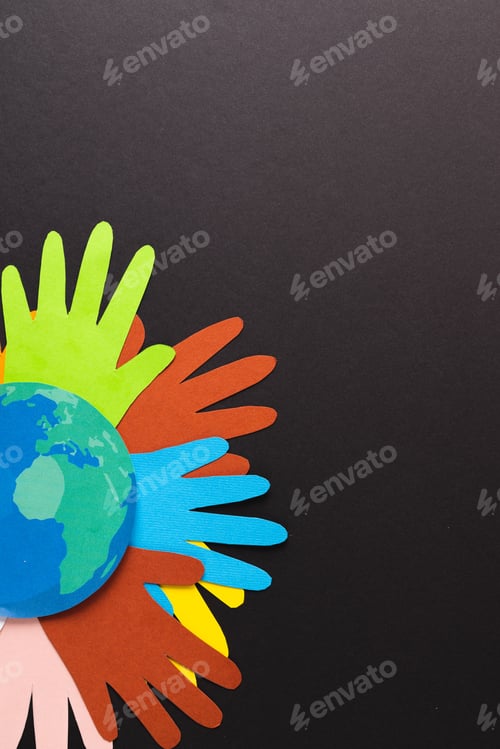 Preview: Paper cut out of multi coloured hands and globe with copy space on black background