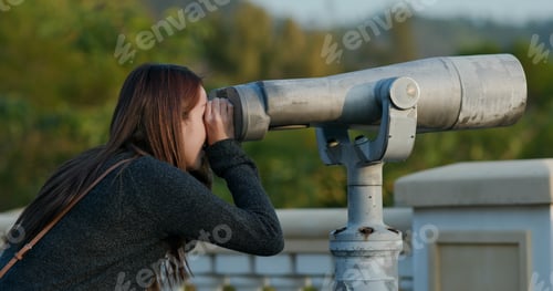 Preview: Woman look at tourist binocular