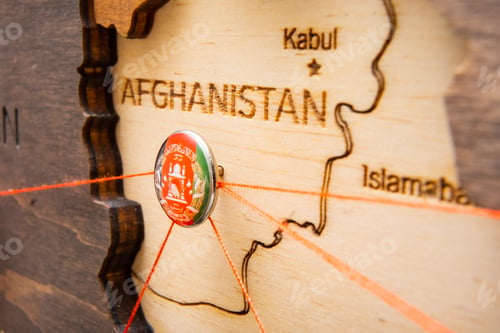 Preview: Afghanistan flag pins and red thread for traveling and planning trip.