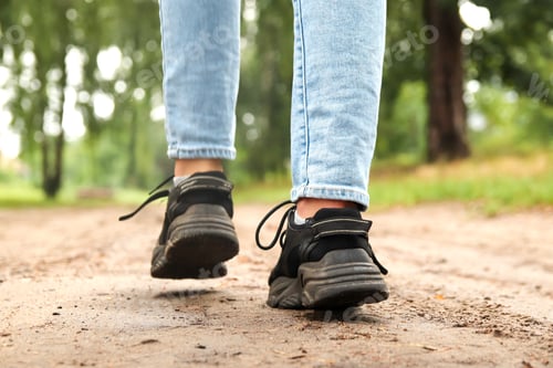 Preview: Fashion designer women's sneaker with high sole. Female sports black shoe on forest background. Temp