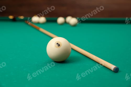 Preview: Billiard balls and cue on table indoors