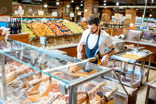 Preview: Seller with jamon in the supermarket