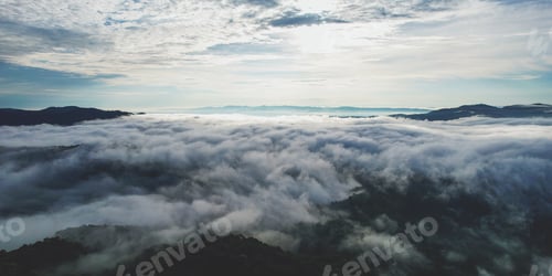 Preview: Aerial landscape view of the sea of fog flowing on hills by drone