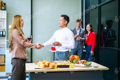 Preview: Four Asian friends, two men and two women, celebrate in an office party. They enjoy a fun-filled