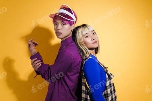 Preview: Asian couple with multicolored hair posing back to back