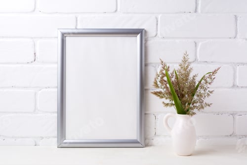 Preview: Silver frame mockup with grass and green leaves in pitcher vase