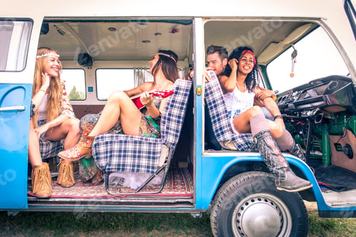 Preview: Happy friends driving a vintage minivan