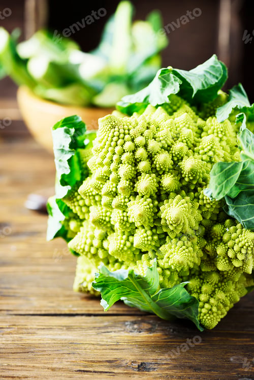 Preview: Raw fresh Roman cauliflower on the wooden table