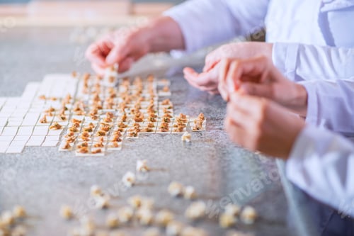 Preview: Two woman are making Turkish Ravioli with meatball and pasta dough