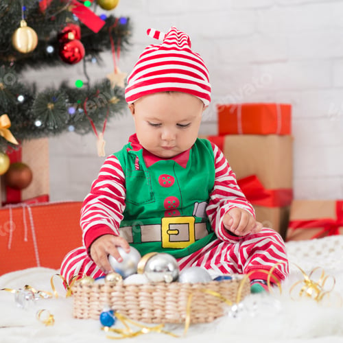 Preview: Cute baby sorting Christmas decorations at home