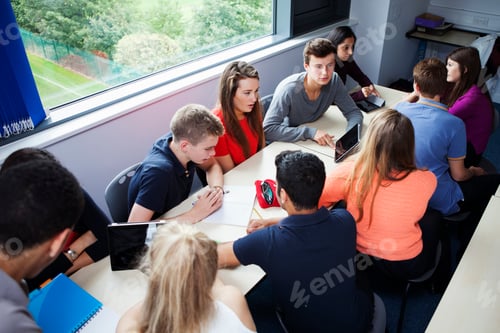 Preview: Teenage schoolchildren working together with digital tablet