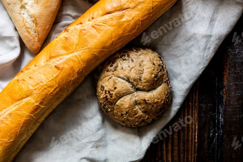 Preview: bread, bun and baguette on a table