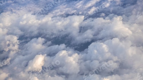 Preview: The beautiful cloudscape with clear blue sky. A view from airplane window.