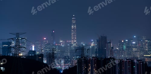 Preview: Scenic drone shot over the skyscrapers in a city at night