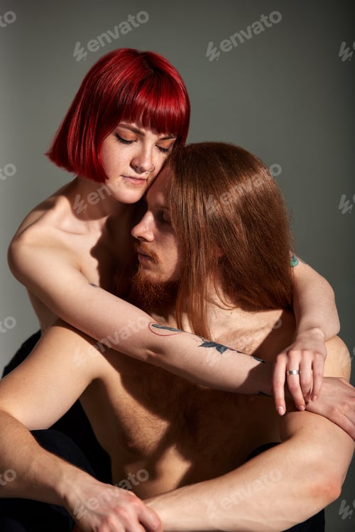 Preview: Studio portrait of sexy passionate couple in love. The hands of a woman embrace a handsome half