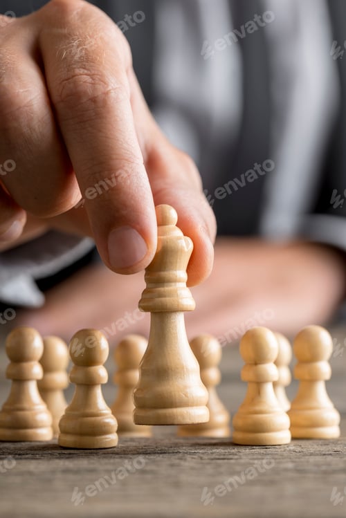 Preview: Man playing chess moving the queen piece