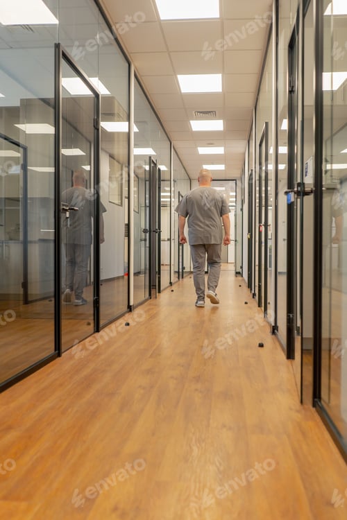 Preview: corridor professional laboratory for making dental prosthesis veneers glass doors modern office man