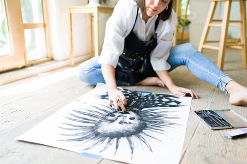 Preview: Caucasian artist finishing an art piece