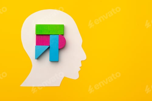 Preview: Papercut head silhouette with toy constructor pieces on yellow background