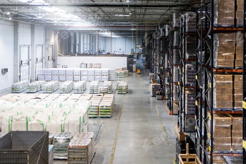 Preview: Huge distribution warehouse with high shelves, view from above