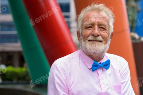Preview: Handsome senior tourist man exploring the city of Bangkok, Thail