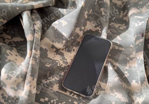 Preview: Blank mobile phone on military equipment, template for SMS, Ukrainian Armed Forces