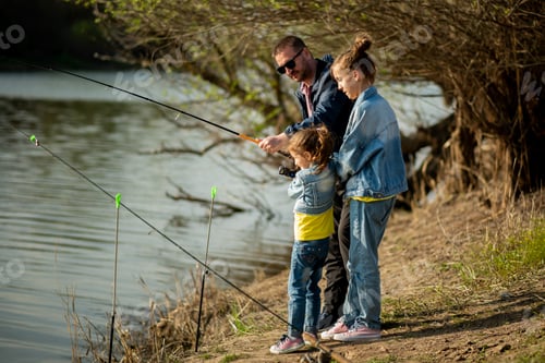 Preview: A dad and his two daughters are fishing in the river.