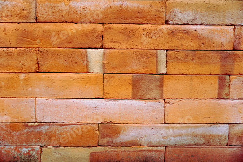 Preview: Close-up shot of weathered orange brick wall texture with subtle color variations