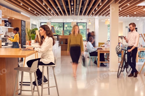 Preview: Interior Of Busy Office Coffee Shop With Businesspeople Working At Tables