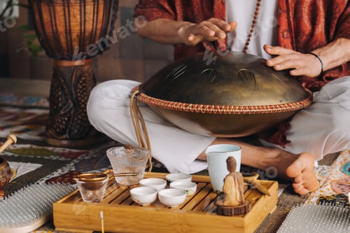 Preview: Close-up of a man's hand playing a modern musical instrument - the Orion tongue drum during the