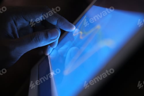 Preview: A detailed and closeup view of a hand engaging with a modern touchscreen electronic device
