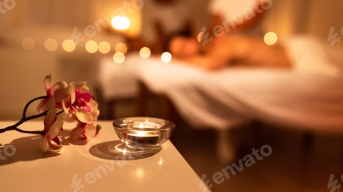 Preview: Couple Receiving Massage Indoor, Spa Composition With Candle And Flowers