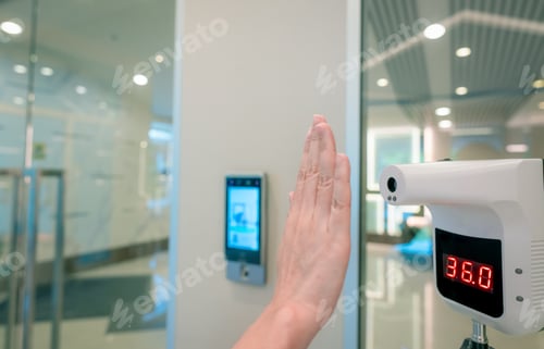 Preview: Selective focus on non-contact temperature assessment device. People check body temperature