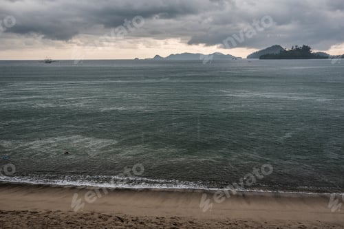 Preview: Tropical storm with thunderstorm and stormy clouds over the ocean at a beach, Padang in West Sumatra