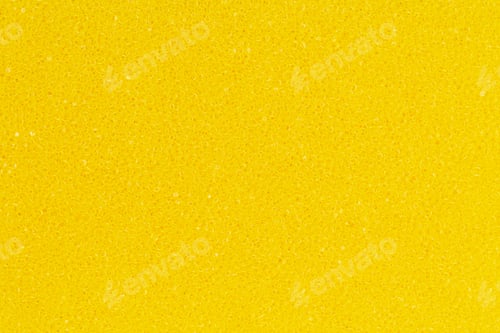 Preview: Bright yellow color foam sponge porous texture background. Close-up of abstract synthetic material