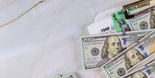 Preview: Economic stimulus tax return check and US 100 dollar bills currency