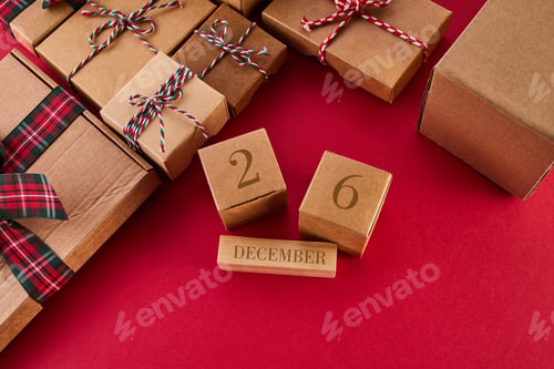 Preview: Boxing Day Concept. Different kinds of gift boxes on red background