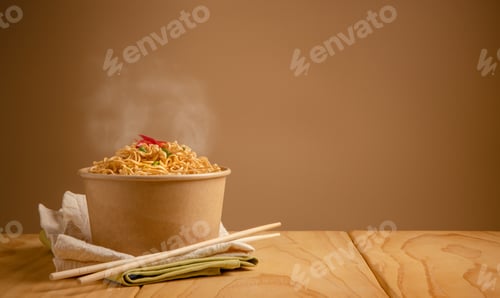 Preview: Ramen in Takeout Container with Chopsticks on Table