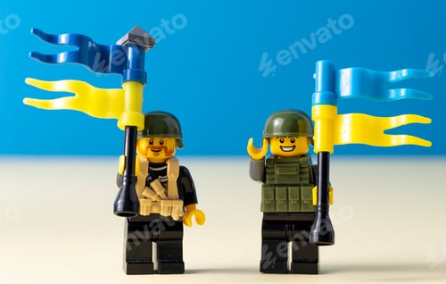 Preview: Lego little men with flags of Ukraine. A minifigure toy man holding a blue flag. Support of the