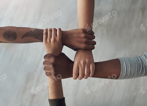 Preview: Cropped shot of a group of unrecognizable people holding each others wrists