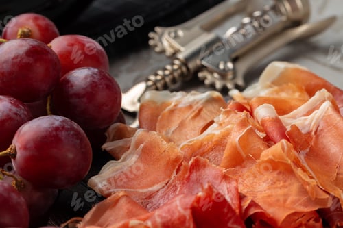 Preview: Wooden platter with meat cuts close up