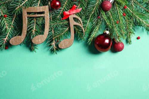 Preview: Flat lay composition with Christmas decor and music notes on light green background, space for text