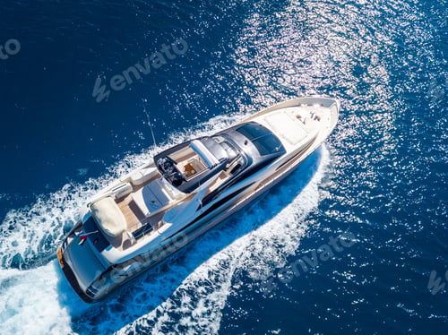 Preview: Aerial shot of a yacht sailing on the sea at daytime