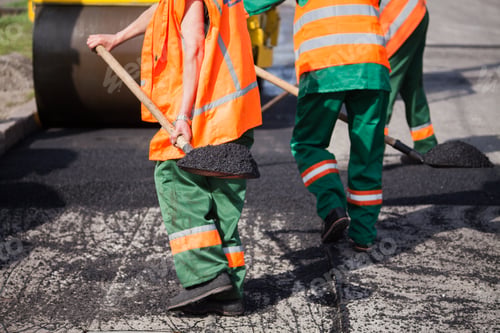 Preview: Repair of roads, highways and sidewalks. Patching. Working with a shovel falls asleep in the pit