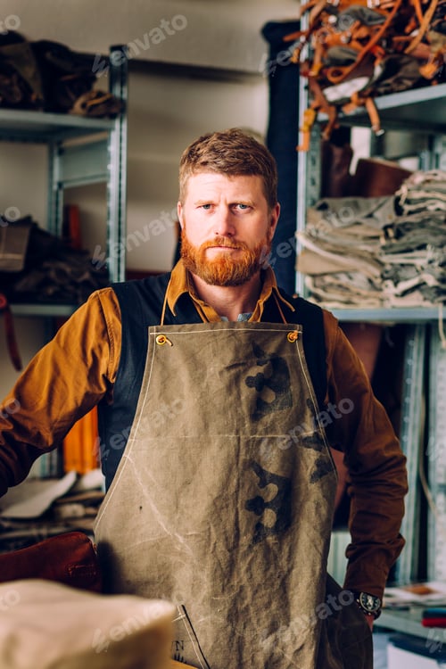 Preview: Artisan in his workshop standing with confidence