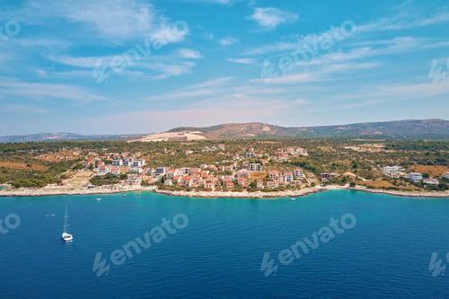 Preview: Aerial view of Adriatic sea coastline with coastal village along shoreline