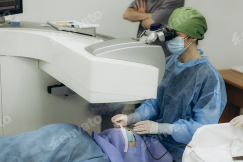 Preview: Eye surgeon performing laser vision correction surgery