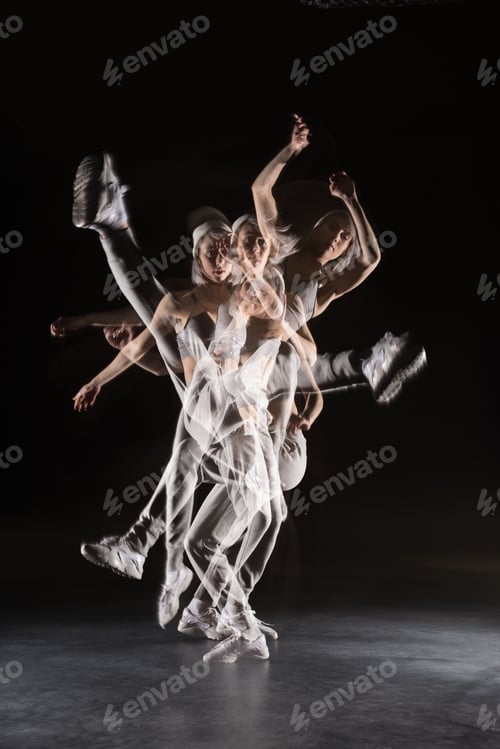 Preview: woman in sports clothing dancing on black