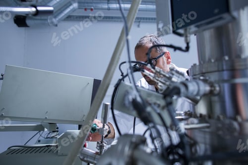 Preview: Microscopy lab assistant working on equipment